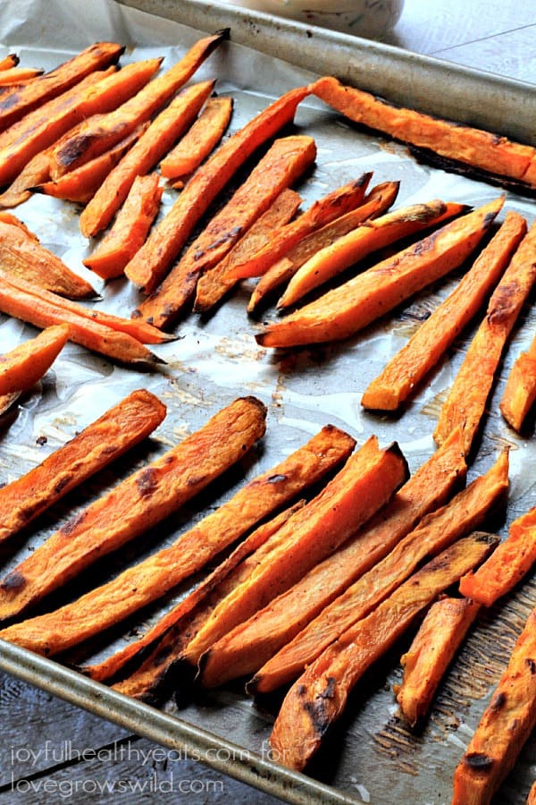 Crispy Baked Sweet Potatoes Fries served with a delicious Chipotle Lime Aioli is a great healthy side dish idea! | LoveGrowsWild.com