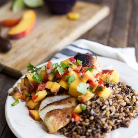 Pan Seared Chicken Breast with fresh Peach Salsa, a flavorful chicken dinner that's done in 30 minutes. It's the perfect meal for a school night! | joyfulhealthyeats.com #paleo #glutenfree