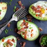 BAKED EGGS IN AVOCADO with crispy bacon and a Sriracha drizzle! The ultimate Paleo Breakfast, high in protein & fiber and loaded with flavor! I guarantee you'll be addicted after the 1st bite! | joyfulhealthyeats.com