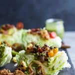 SOUTHWESTERN WEDGE SALAD with seasoned chicken, bacon, onion rings, charred corn a POBLANO DRESSING you'll adore. The wedge salad only takes 30 minutes to make & is under 400 calories a serving! | joyfulhealthyeats.com | Gluten Free Recipes
