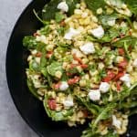 A simple healthy gluten free GRILLED CORN SALAD filled with fresh greens, roasted red pepper, and goat cheese then tossed with a spicy JALAPENO DRESSING. This Corn Salad is the ultimate side dish of the summer! | joyfulhealthyeats.com