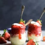 SKINNY CHEESECAKE for two made with greek yogurt and topped with fresh strawberries slightly sweetened with honey. The perfect healthy sweet dessert for those late night cravings! | joyfulhealthyeats.com