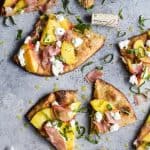 Grilled Flatbread Pizza topped with Peaches, Prosciutto, Goat Cheese, and fresh Basil! The ultimate summer grilling recipe done in just 30 minutes!