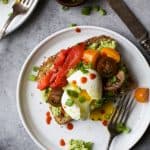 Smashed Avocado Toast topped with a perfectly cooked Soft Boiled Egg and fresh veggies. This is one Avocado Toast you'll devour! | vegetarian