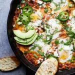 One Pot Mexican Shakshuka an easy dinner recipe made in 30 minutes only 206 calories a serving. Eggs baked in a spicy mexican inspired tomato sauce - it's egg-cellent!