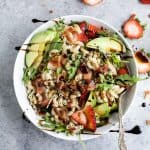 Easy Strawberry Avocado Pasta Salad tossed with fresh arugula, bacon, and a balsamic vinaigrette. The perfect pasta salad for those summer nights! | #ad | gluten free recipes