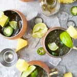 A Pineapple infused Moscow Mule topped with Jalapeno for a spicy kick. This refreshing sip will be your new favorite cocktail this summer!