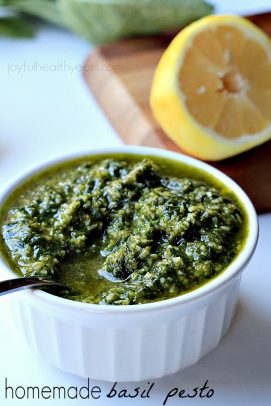 Basil Pesto in a Small White Dish Beside Half a Lemon