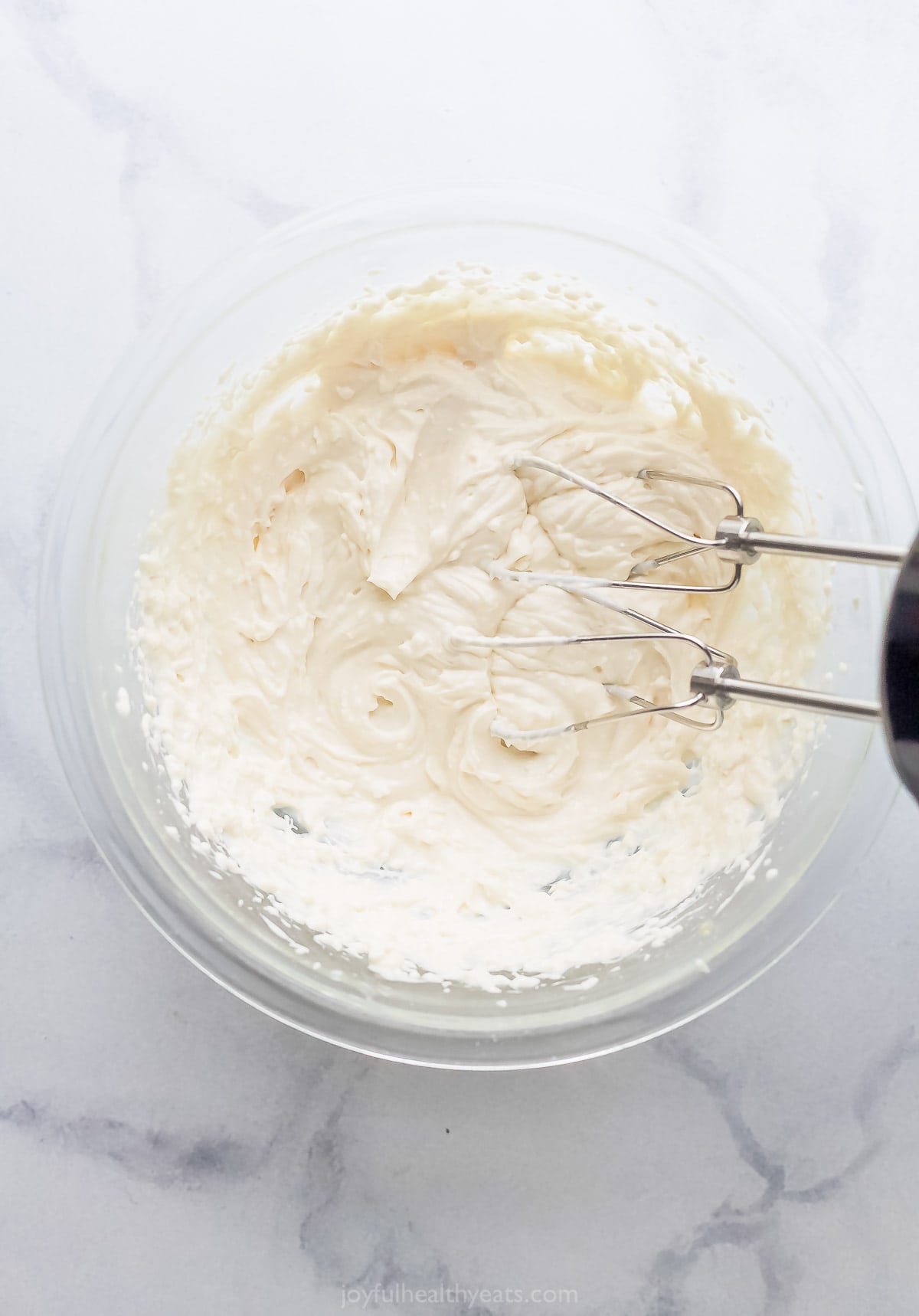 Beat the cream cheese frosting. 