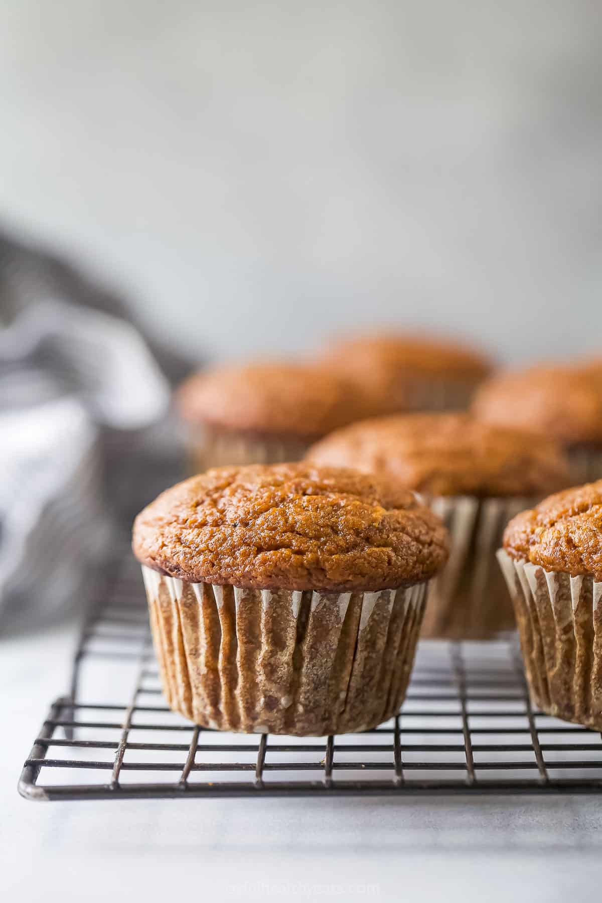 These pumpkin spice cupcakes with cinnamon and a healthy cream cheese frosting are the perfect 35-minute fall treat. Baked cupcakes without frosting.