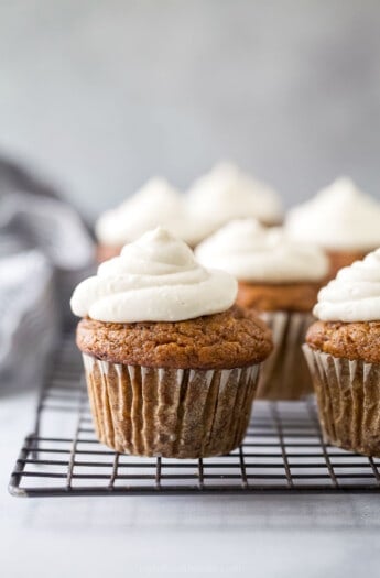 Close-up of a cupcake with cream cheese frosting.