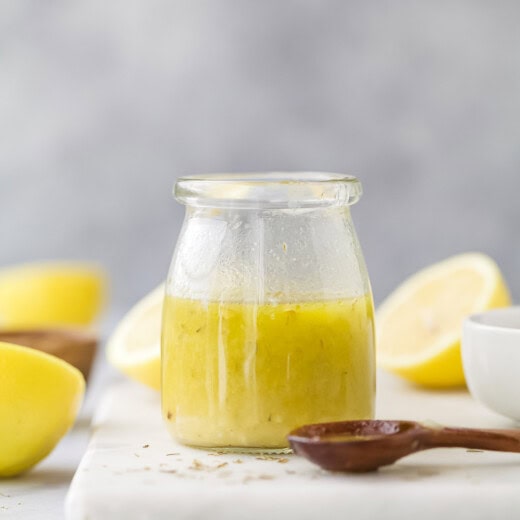 Homemade lemon vinaigrette in a glass jar.