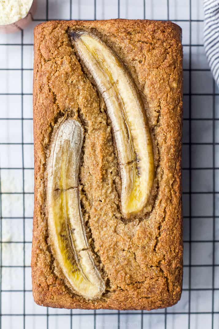 An Unsliced Loaf of Paleo Banana Bread Topped with Two Bananas