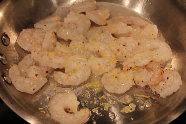 Shrimp Sautéing with Seasonings in a Metal Pan