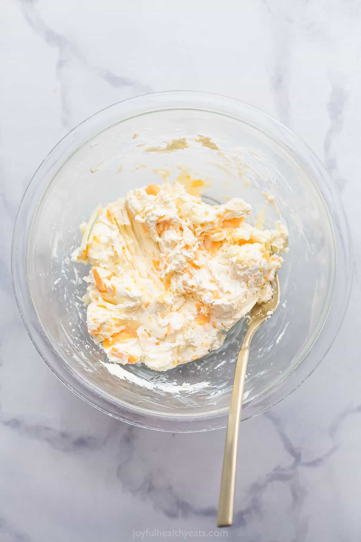 Mixing cream cheese, salt, garlic, and lime juice in a bowl. 