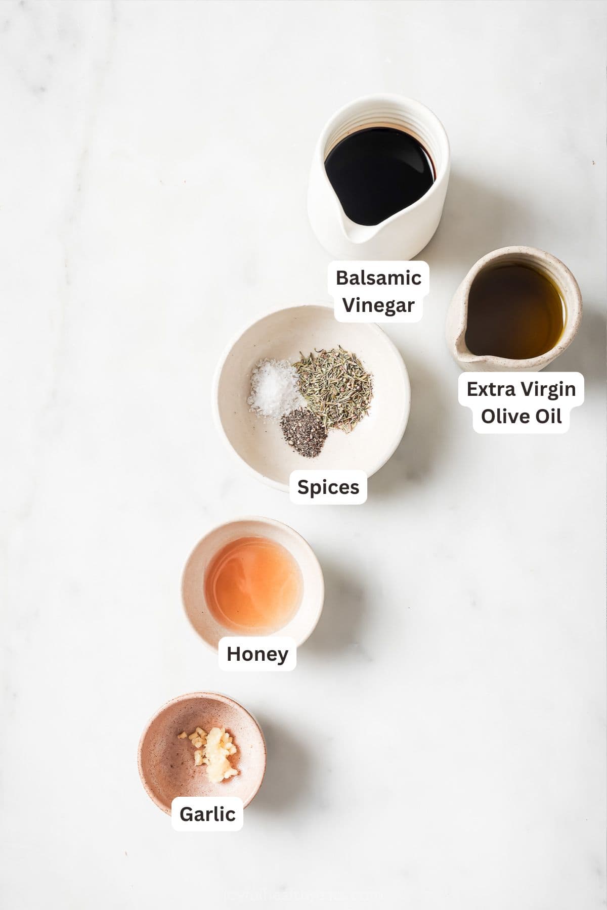 This recipe for balsamic vinaigrette is easy to whip up and the sweet, tangy flavor brings out the best in any salad—and so much more! Overhead view of ingredients for balsamic vinaigrette