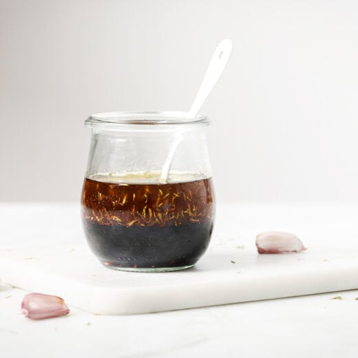Homemade balsamic vinaigrette in jar with spoon