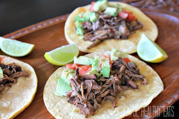 Chipotle Beef Barbacoa Tacos on a wood plate