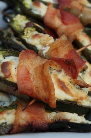 A Pile of Stuffed Jalapeños on a White, Rectangular Plate