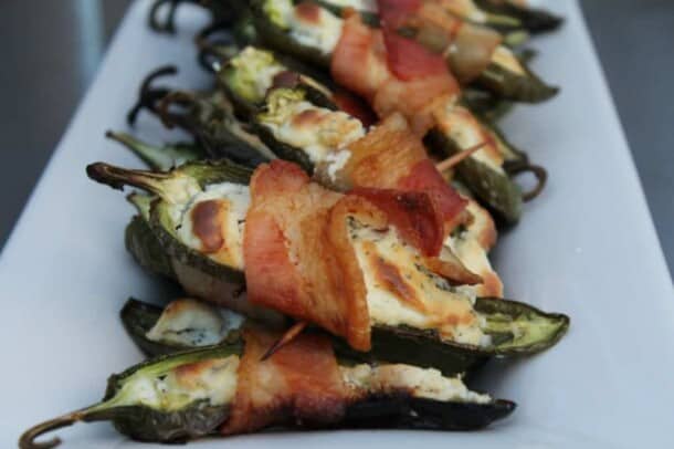 A Pile of Stuffed Jalapeños on a White, Rectangular Plate