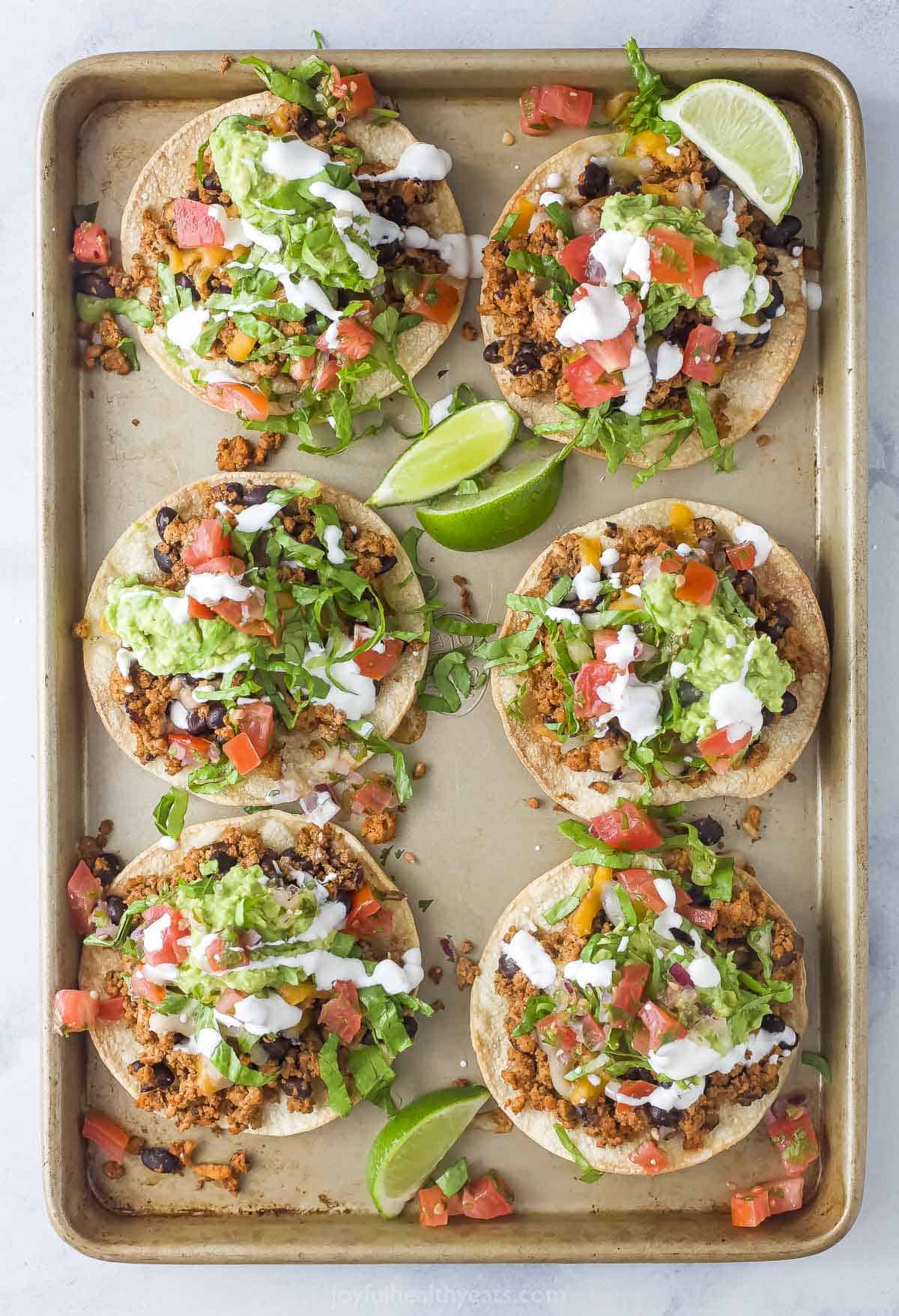 Tray of crispy turkey tostadas recipe in the baking sheet. 