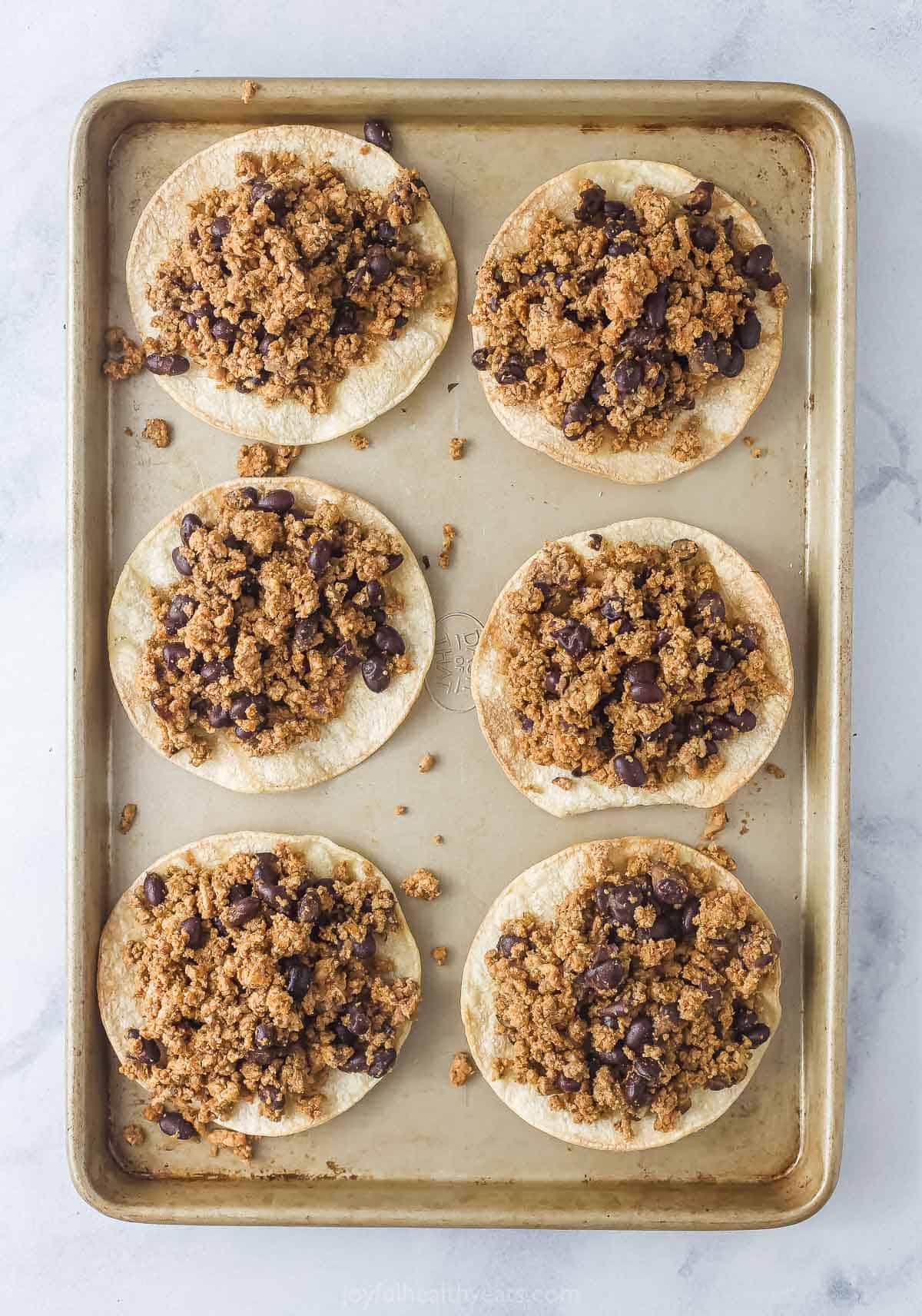 Add the turkey-bean mixture on top of each tortilla. 