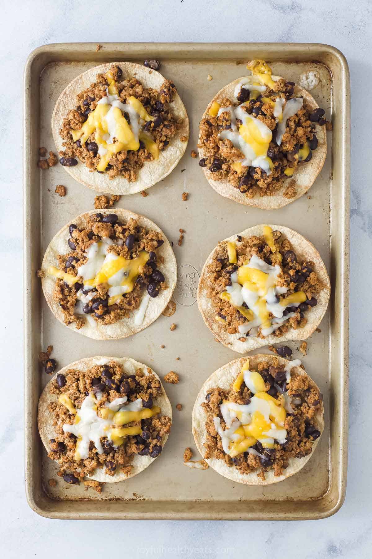 Tostadas with melty cheese after broiling them. 