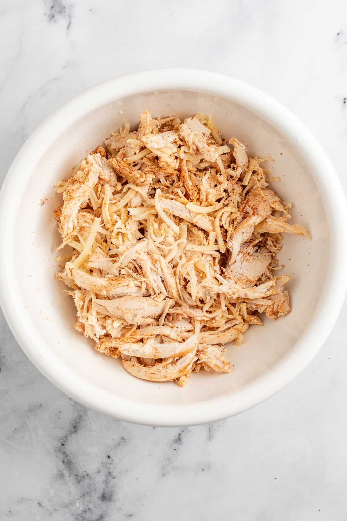 a bowl with shredded chicken