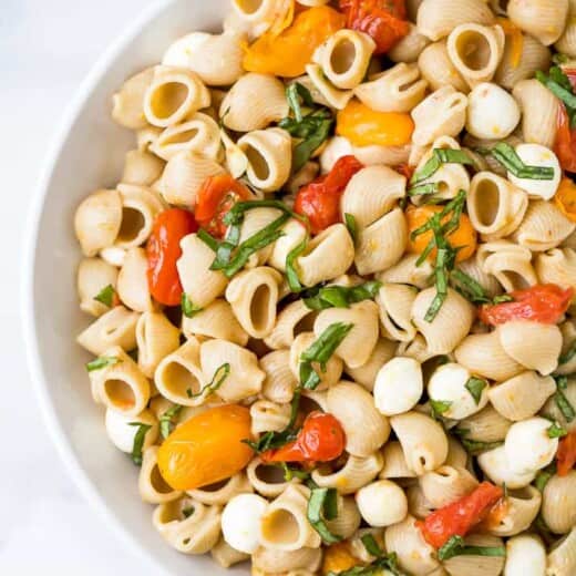 roasted tomato caprese pasta salad in a bowl