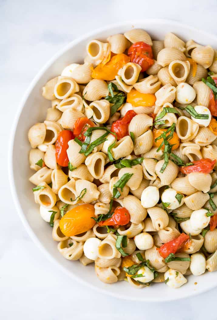 roasted tomato caprese pasta salad in a bowl