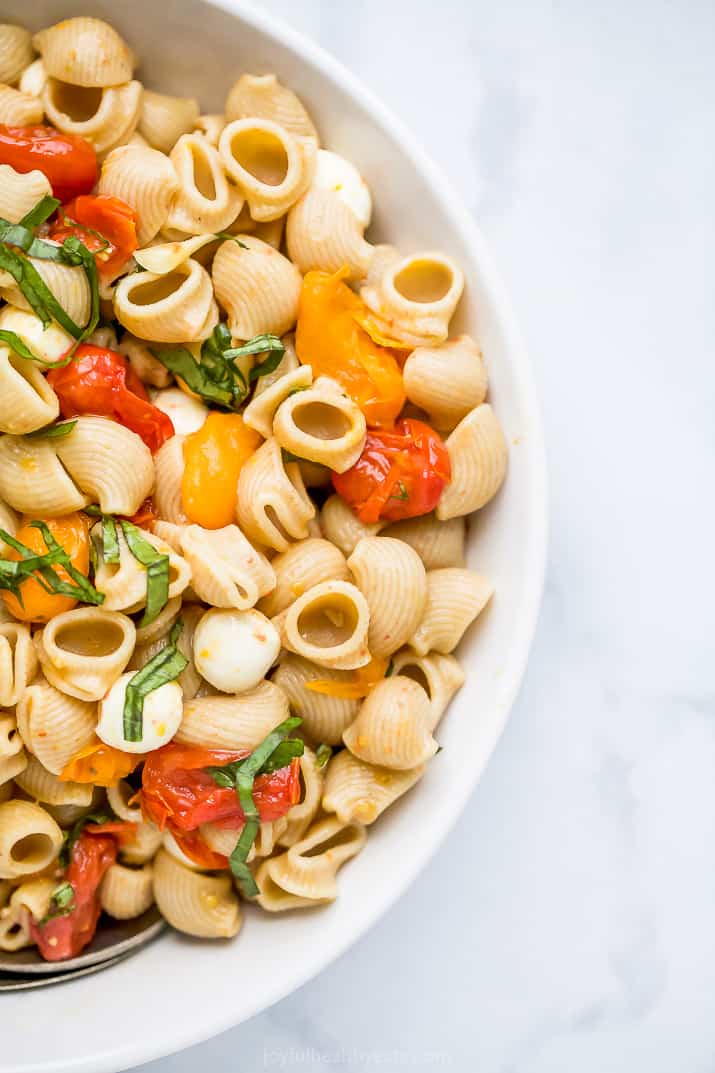 roasted tomato caprese pasta salad in a bowl