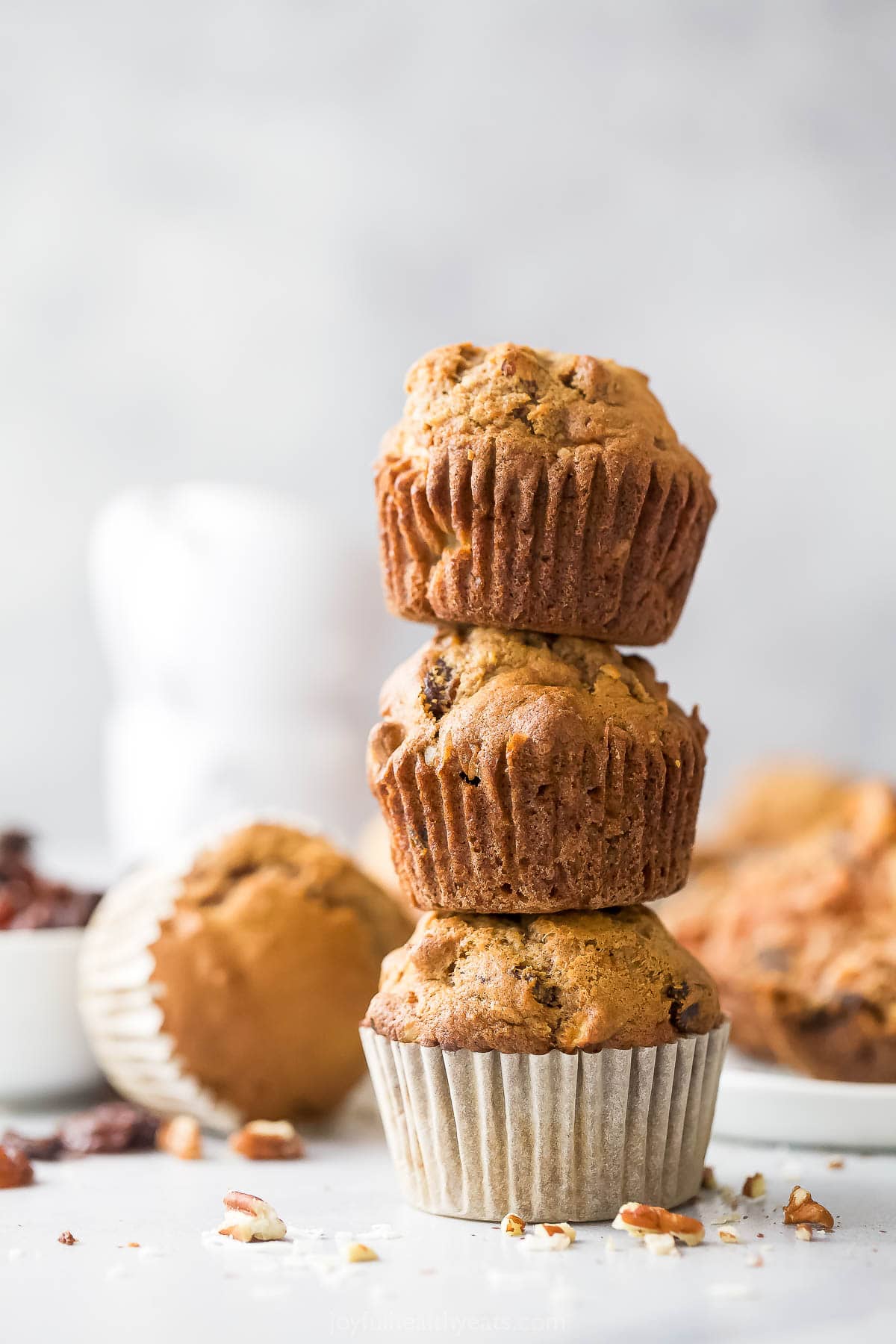 Three stacked morning glory muffins. 