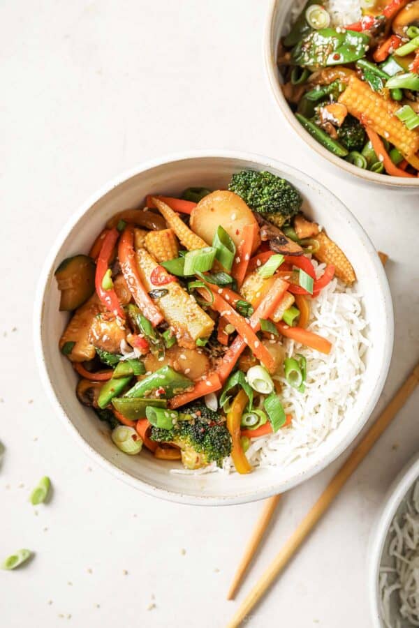 Overhead view of vegetable stir fry in bowl with rice
