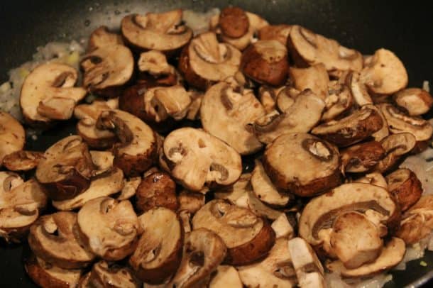 Mushrooms Piled up in a Black Pan