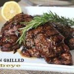 Two Tuscan Grilled Steaks Garnished with a Sprig of Rosemary