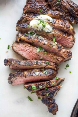 Angled photo of tender grilled ribeye, sliced.