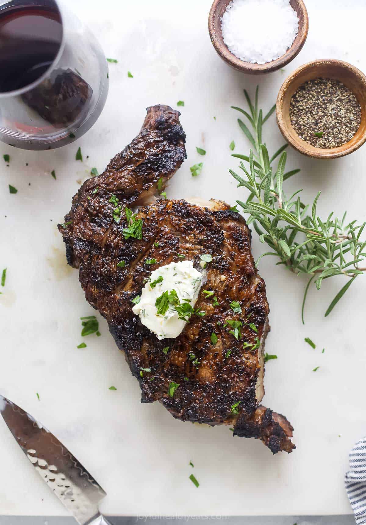 Whole grilled ribeye with grill marks. 