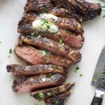A sliced grilled ribeye recipe with grill marks.