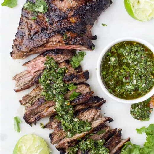 Sliced skirt steak with chimichurri sauce