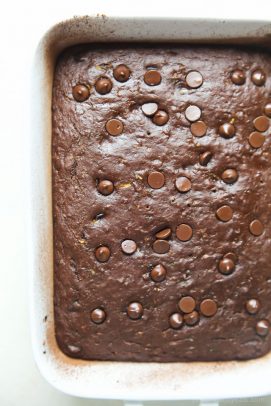 Chocolate chip zucchini brownies in a baking pan.