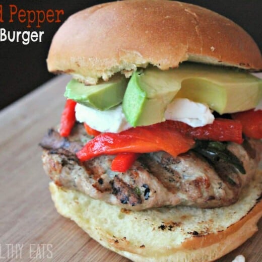 A Roasted Pepper Turkey Burger on a Wooden Surface