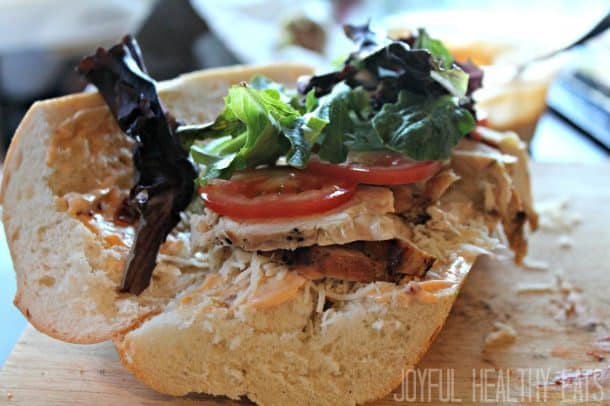 Grilled Chicken Sandwich on French bread topped with lettuce and tomato