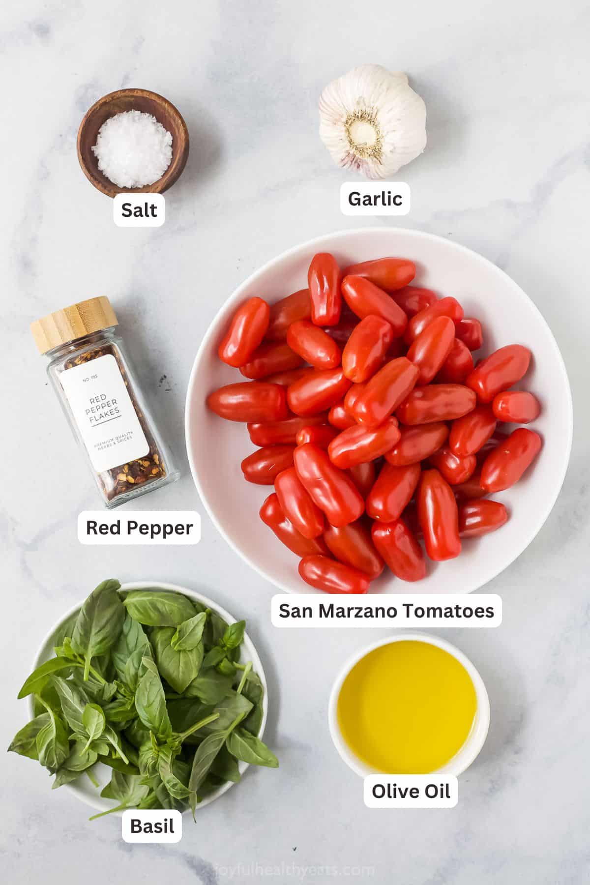 When you got this trusted pasta sauce recipe you will never buy a jar in the store again! Tomatoes, basil and lots of garlic make it delicious. Overhead Views of ingredients for pasta sauce recipes