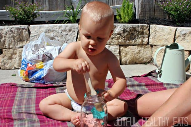 My Son, Cason, Painting a Mason Jar on a Blanket Outside