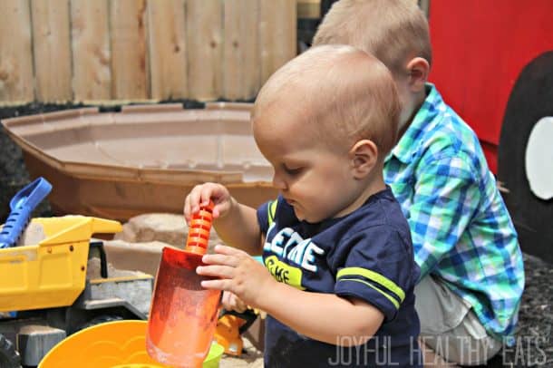 Cason and His Little Cousin Playing in the Sandbox