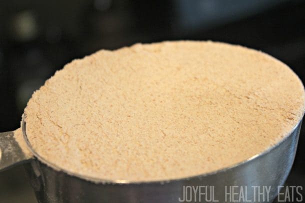 A measuring cup of whole wheat flour