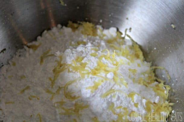 Powdered sugar and lemon zest in a bowl