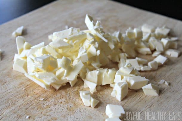 Butter chopped into small pieces on a cutting board