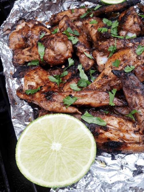 Jerk Chicken Wings in an Aluminum Foil Packet with Half a Lime