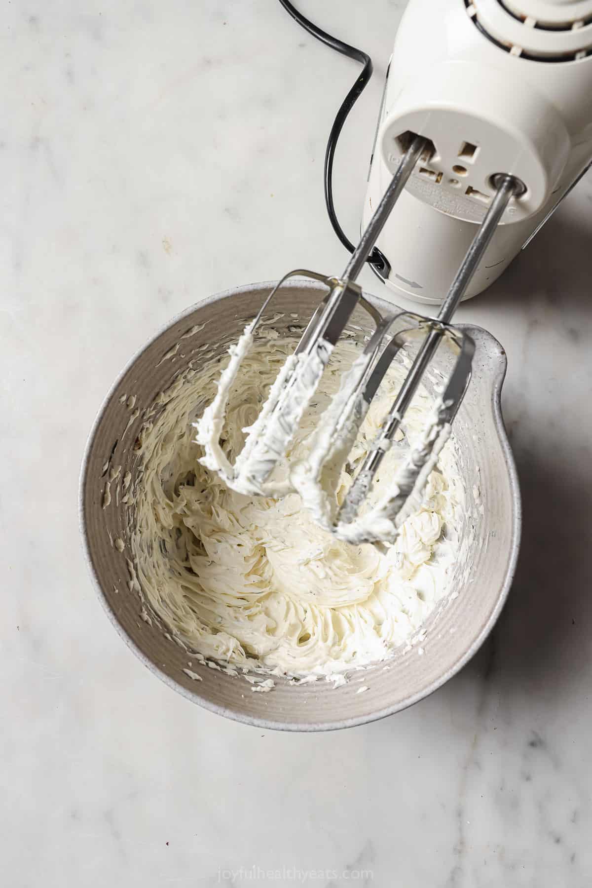 Beating the cream cheese mixture in a bowl. 